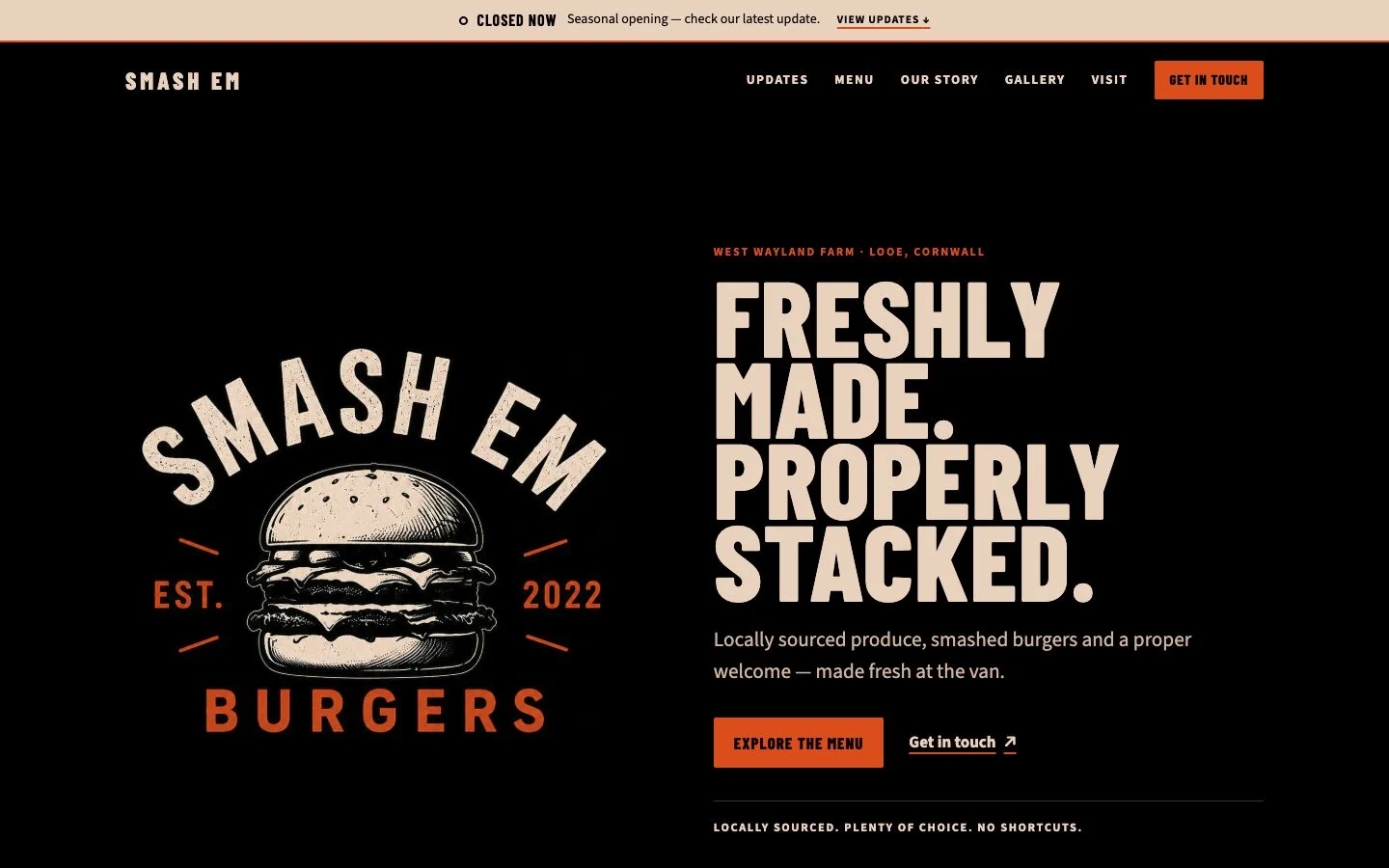 Smash Em's black, cream and orange burger website for Looe, Cornwall, with its illustrated identity and freshly made, properly stacked headline